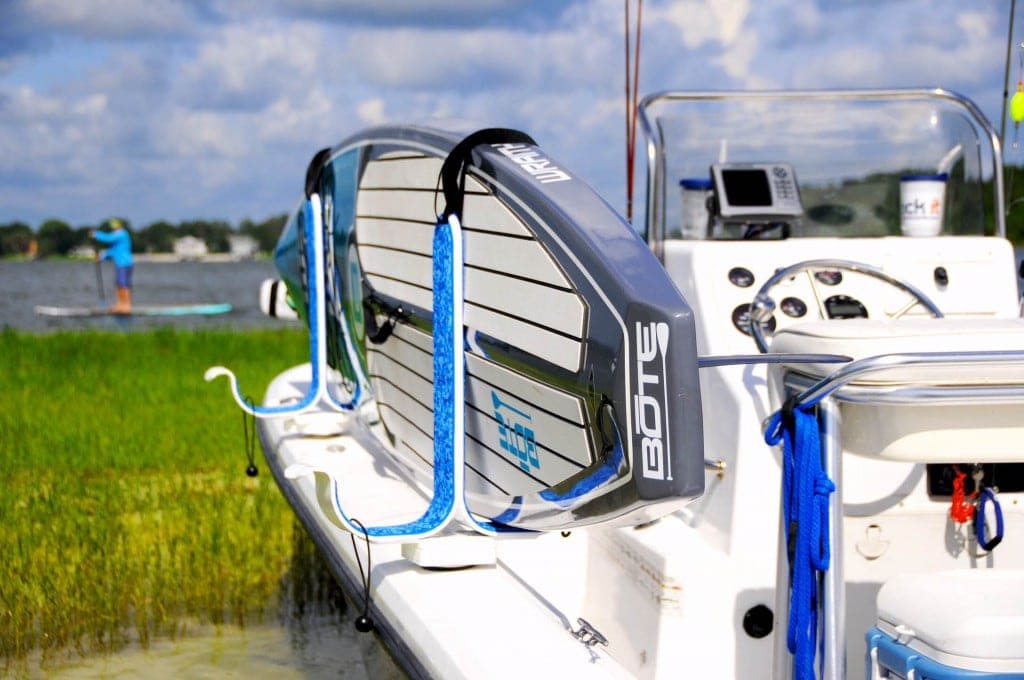 Image of boat with storage rack for SUPs.