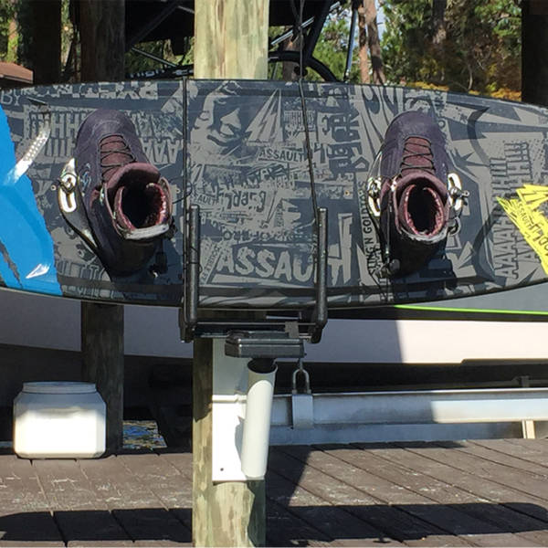 Image of wakeboard stored on dock using Dock/Wall Mounts for Manta Racks.