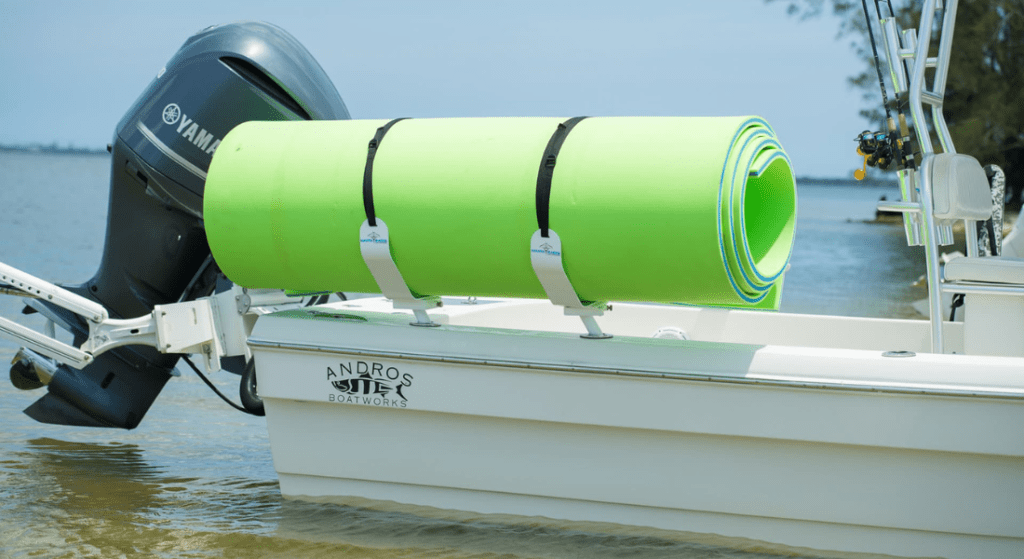 A Manta Racks floating mat storage rack for boats on the side of a boat.